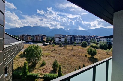 One-bedroom apartment with a frontal view of the Pirin mountain next to the golf course