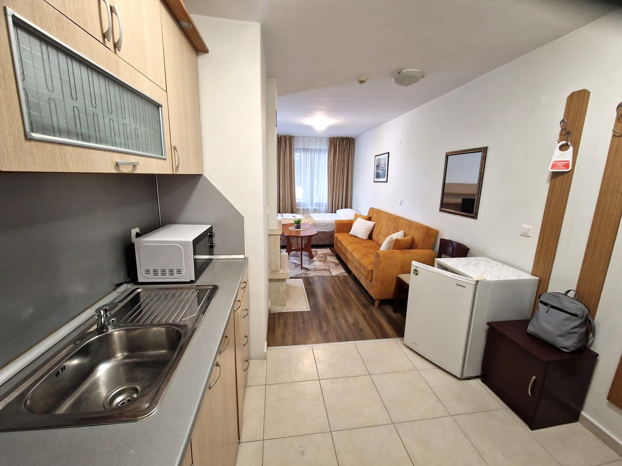 Furnished one bedroom apartment with a fireplace in a gated complex with a pool