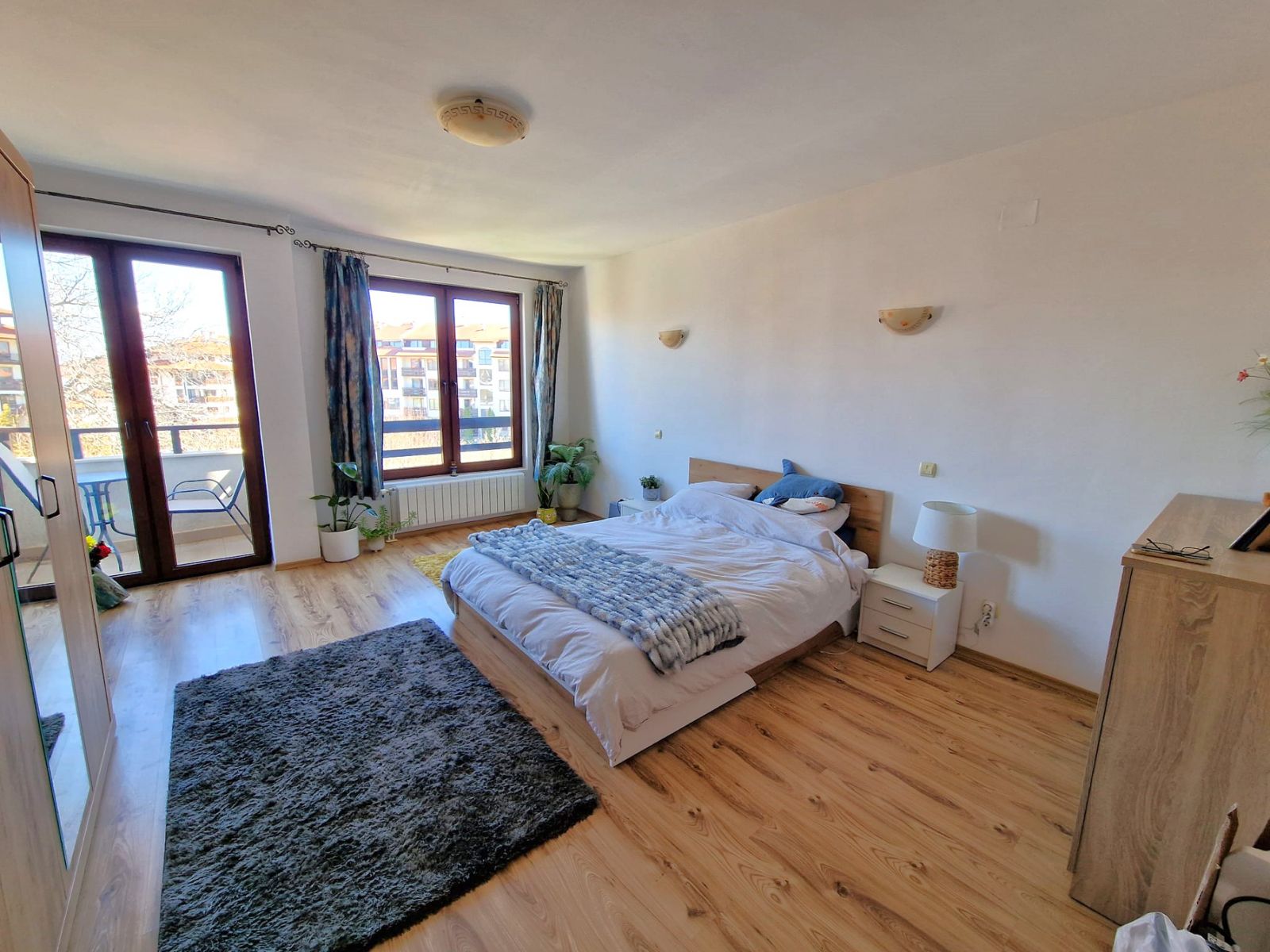 A modern, cozy two bedroom apartment with new furniture and a frontal view of the Pirin Mountains