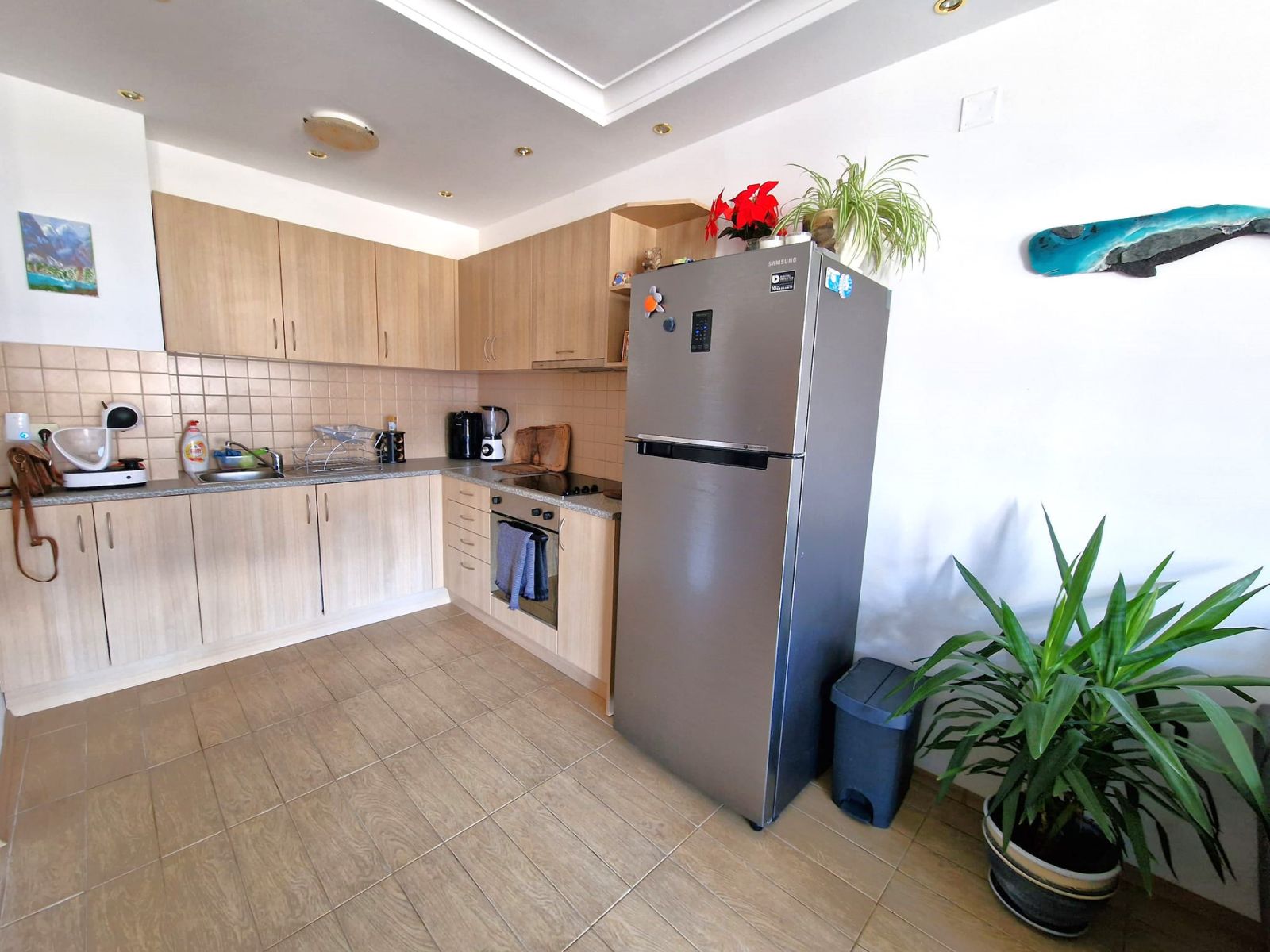 A modern, cozy two bedroom apartment with new furniture and a frontal view of the Pirin Mountains