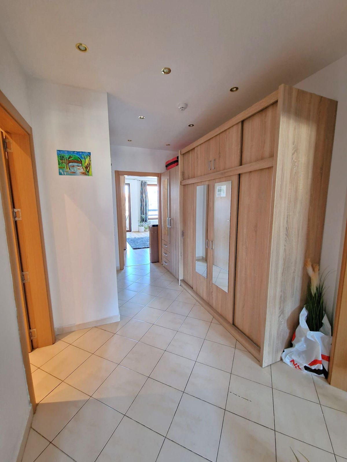 A modern, cozy two bedroom apartment with new furniture and a frontal view of the Pirin Mountains