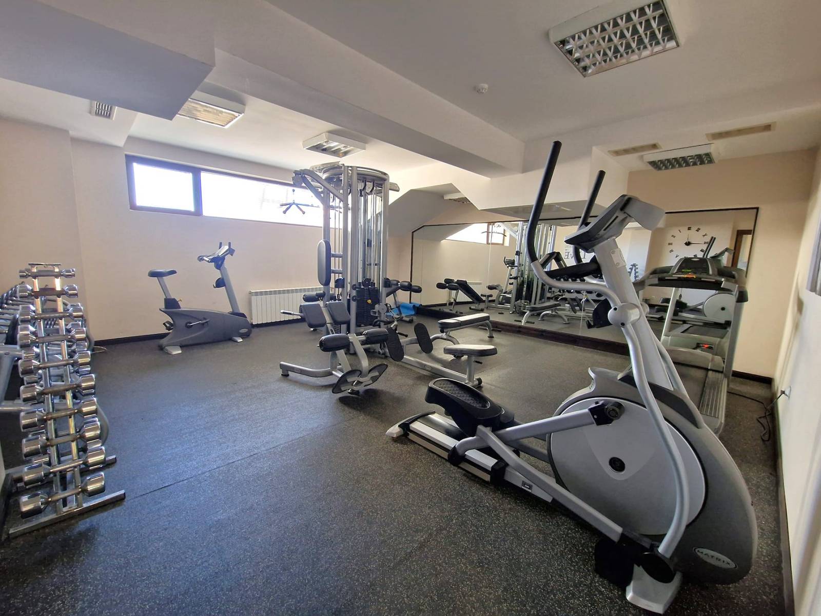 A modern, cozy two bedroom apartment with new furniture and a frontal view of the Pirin Mountains