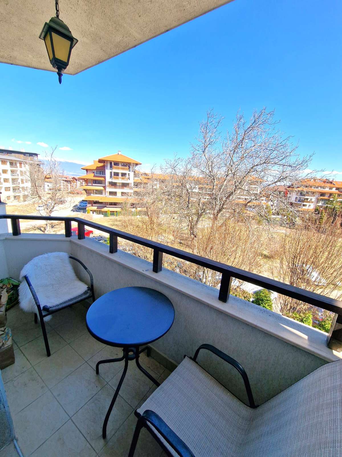 A modern, cozy two bedroom apartment with new furniture and a frontal view of the Pirin Mountains