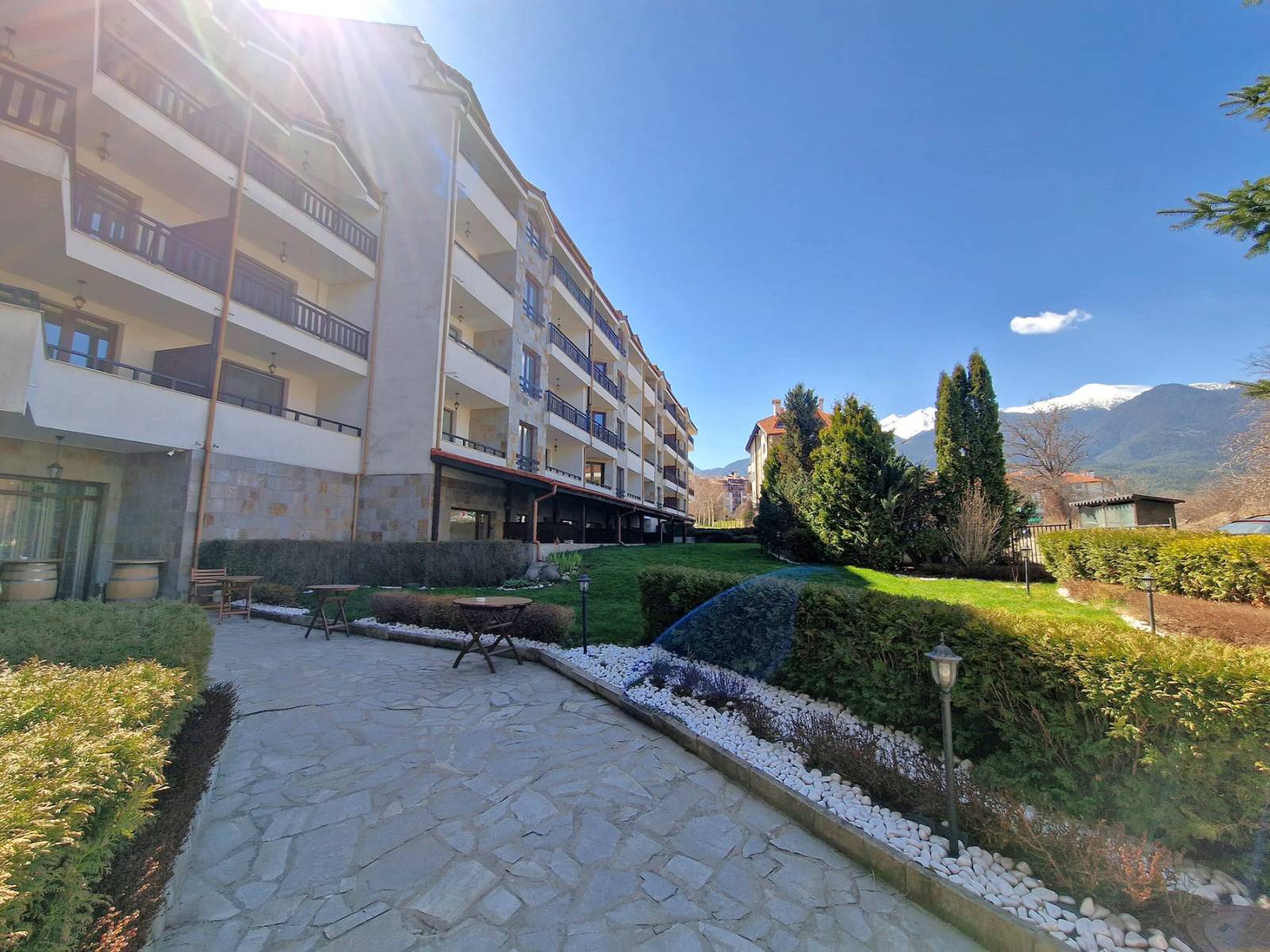 A modern, cozy two bedroom apartment with new furniture and a frontal view of the Pirin Mountains