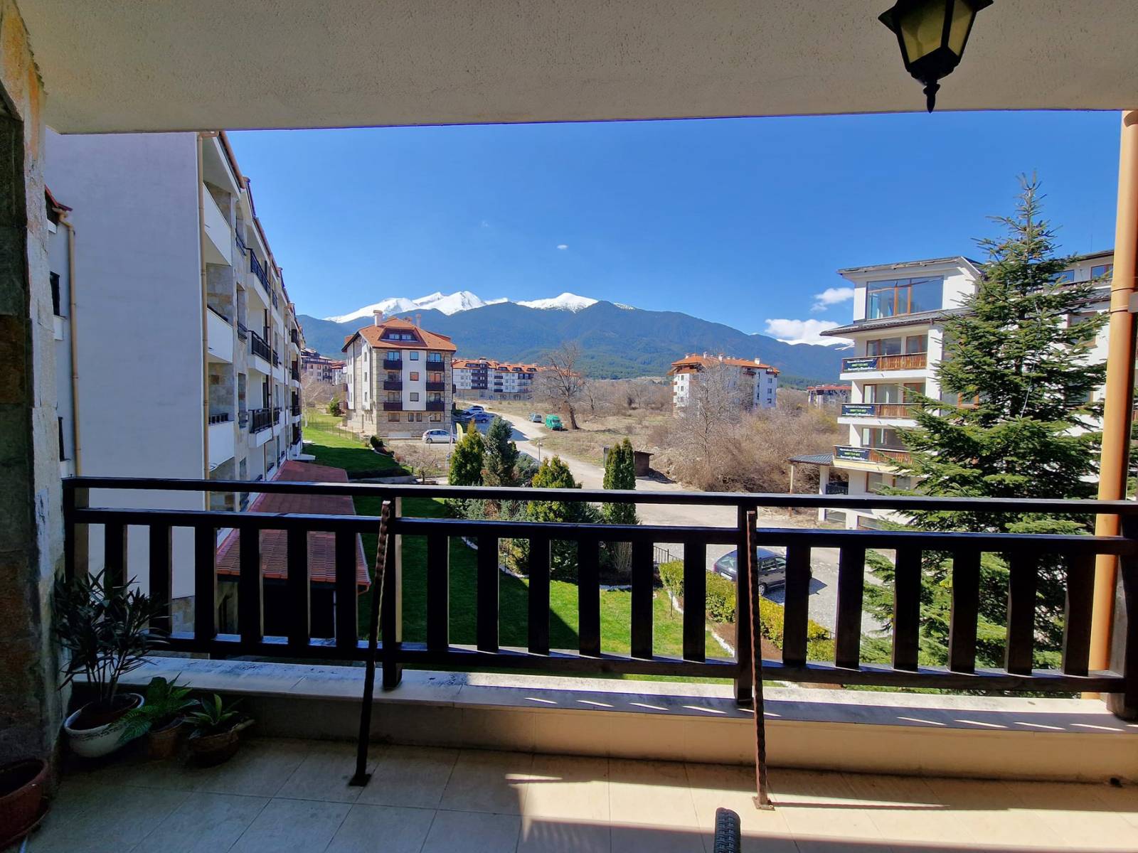 A modern, cozy two bedroom apartment with new furniture and a frontal view of the Pirin Mountains