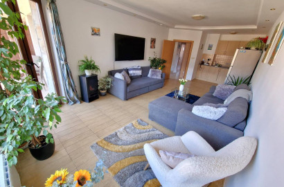 A modern, cozy two bedroom apartment with new furniture and a frontal view of the Pirin Mountains