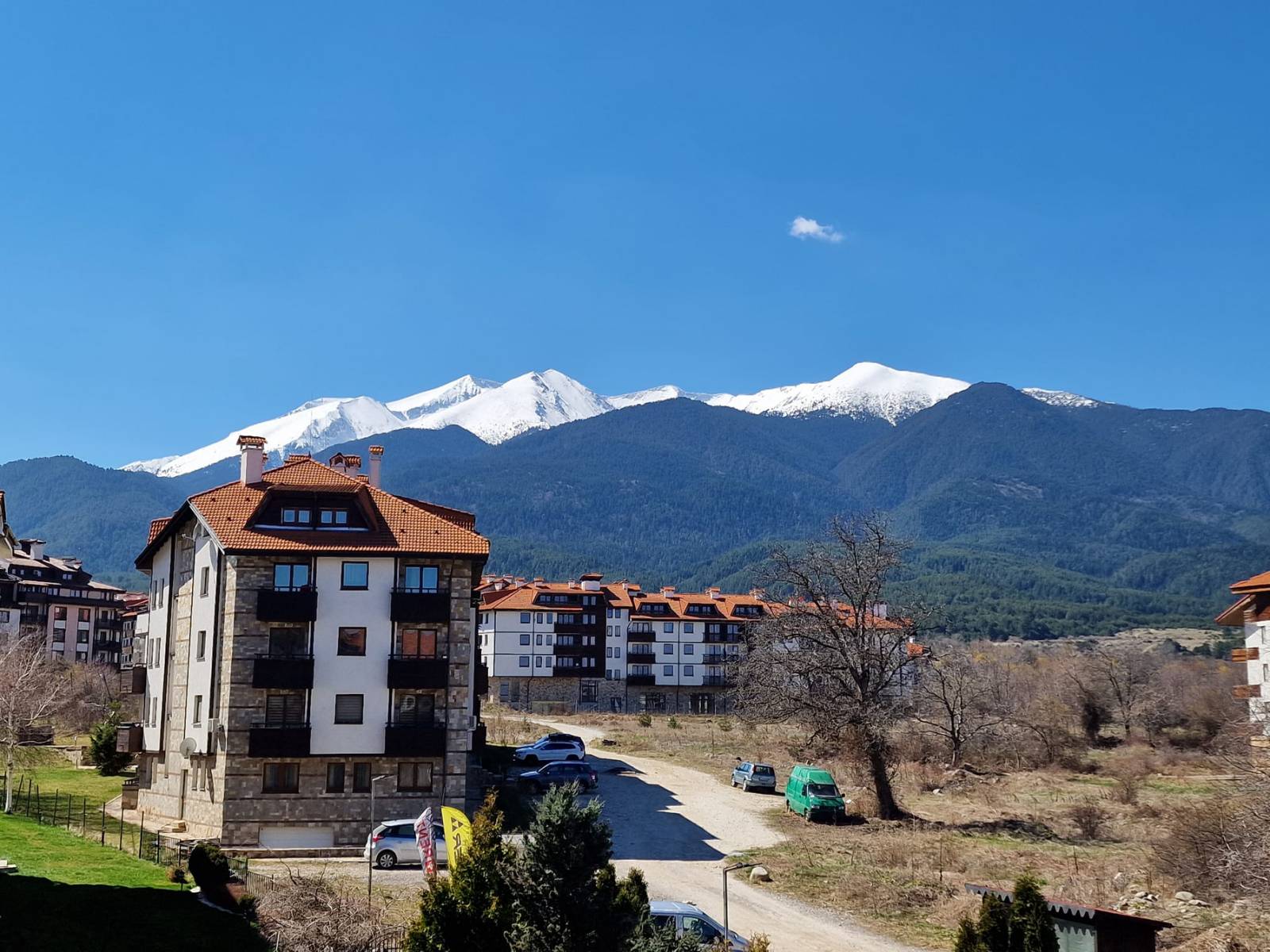 A modern, cozy two bedroom apartment with new furniture and a frontal view of the Pirin Mountains