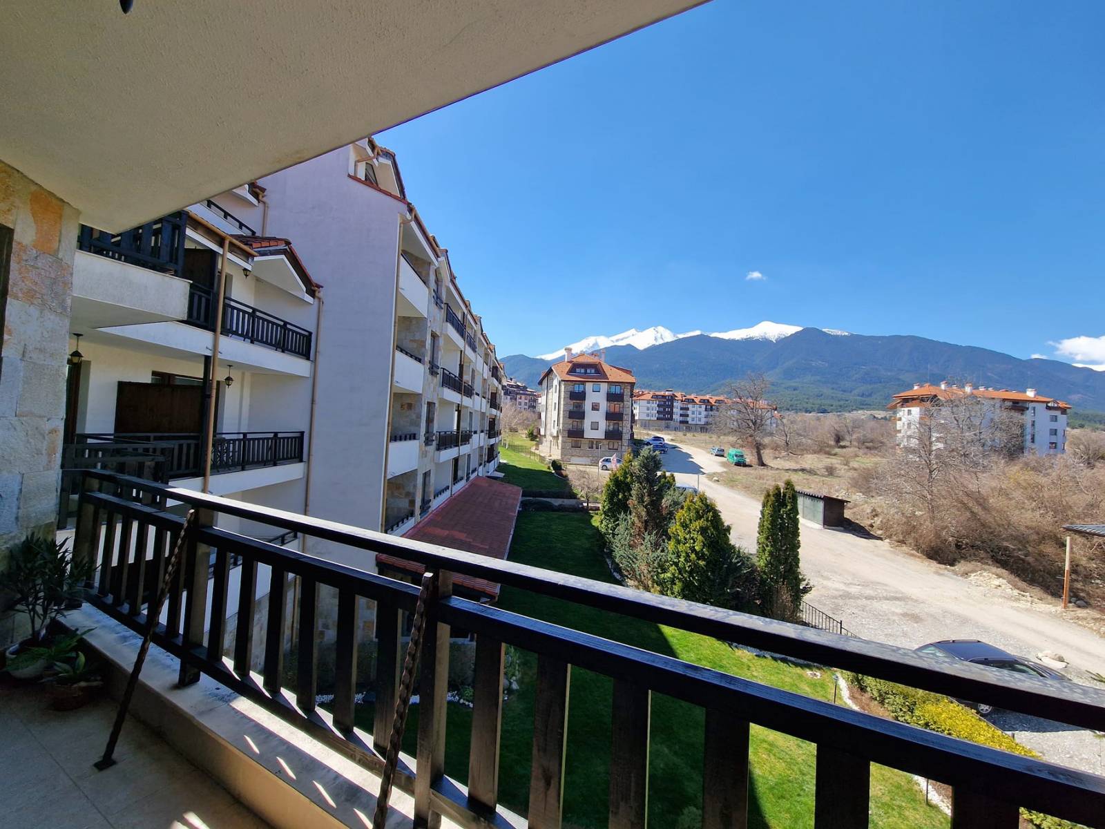 A modern, cozy two bedroom apartment with new furniture and a frontal view of the Pirin Mountains
