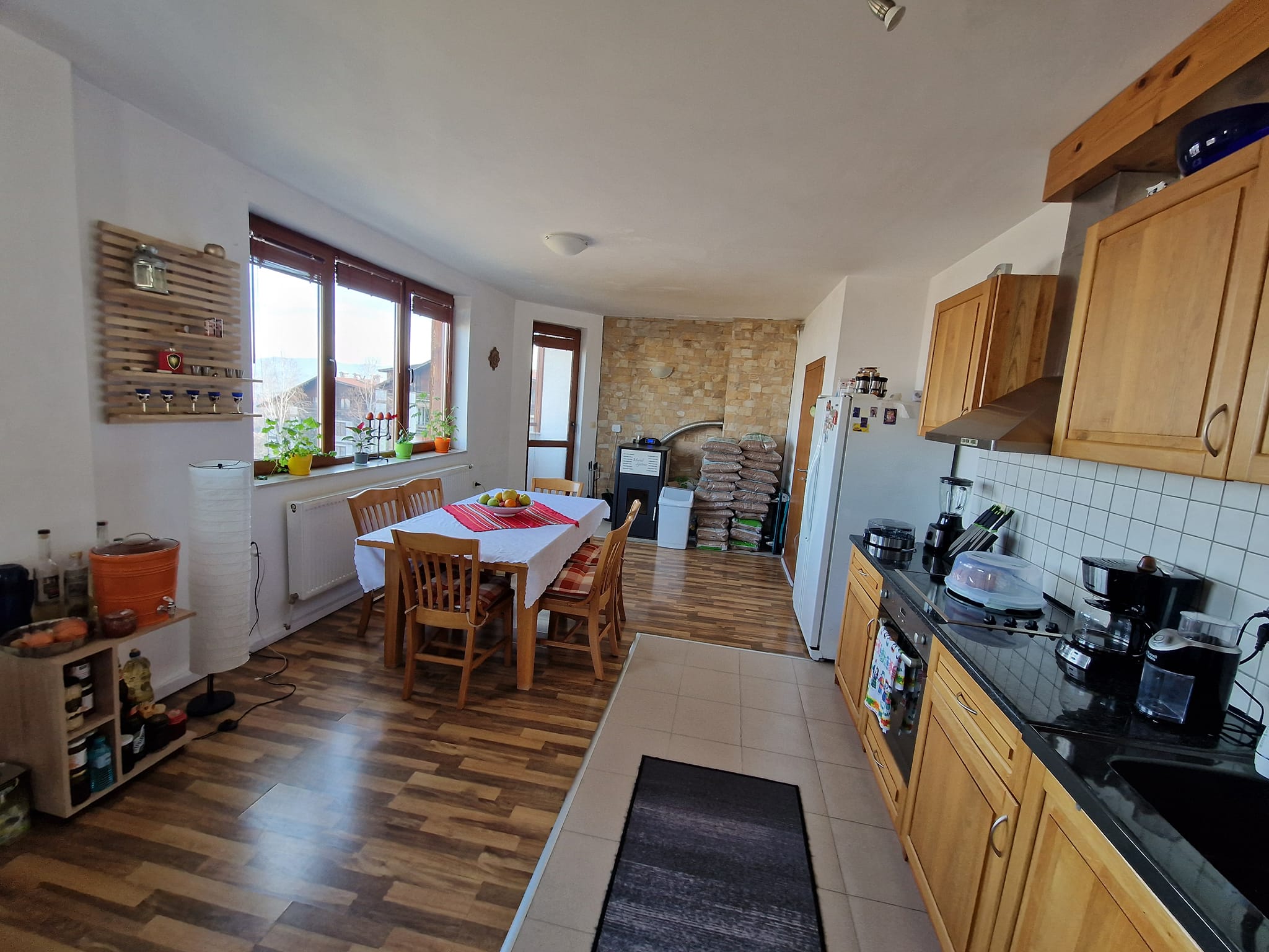 A unique three bedroom apartment with a stunning view of three mountains and the city of Bansko