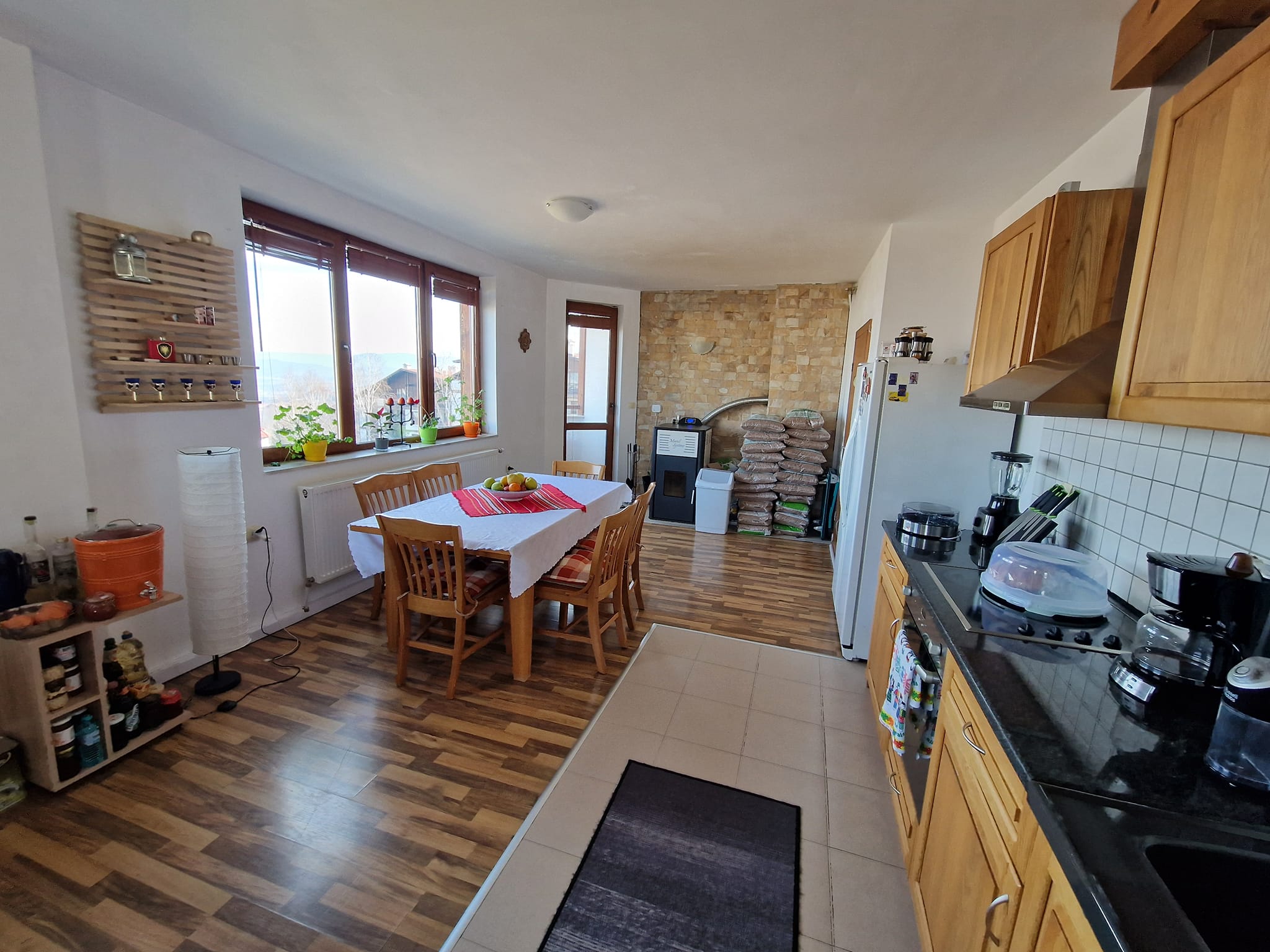 A unique three bedroom apartment with a stunning view of three mountains and the city of Bansko