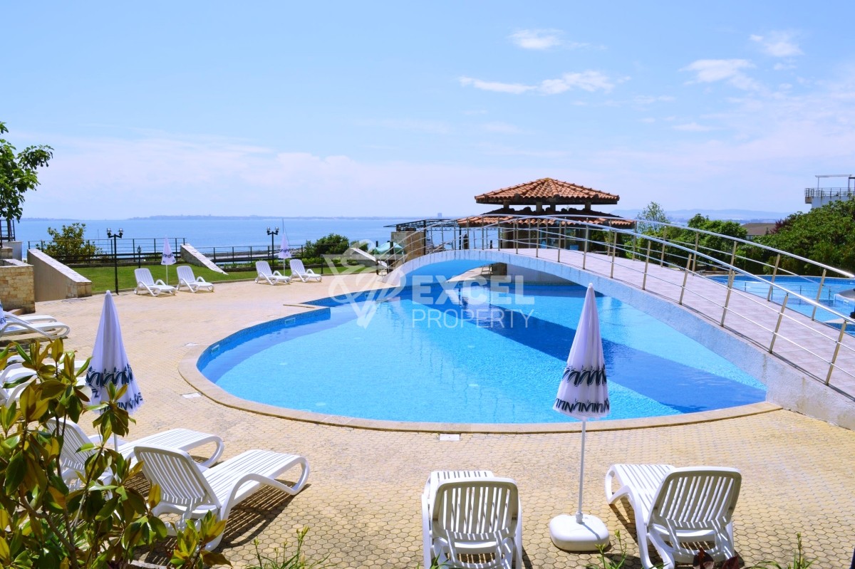 Two-bedroom property on the first line - sea, pool and mountain views